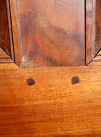 Beauty marks on a French Directoire armoire built in the 1780s